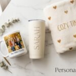 Printify Personalized Gifts collection featuring a custom photo mug, personalized name tumbler, cozy fleece blanket, and gift box on a marble surface